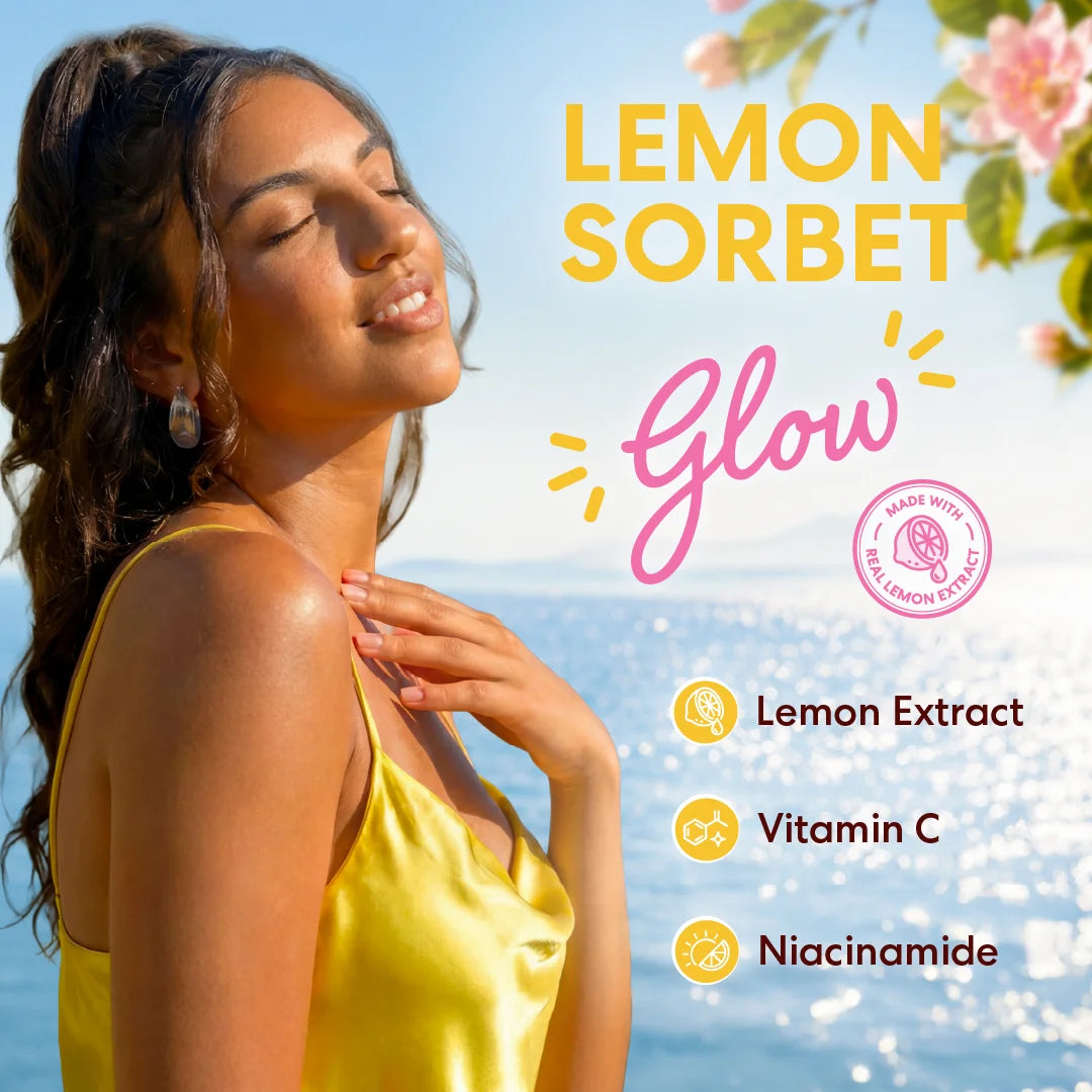 A woman in a yellow satin top stands outdoors by the ocean with her eyes closed, enjoying a sunny day. Large text reads 'LEMON SORBET' and 'Glow,' with smaller text listing 'Lemon Extract,' 'Vitamin C,' and 'Niacinamide.