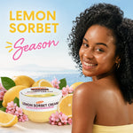 A smiling woman with curly dark hair is shown beside Palmer's Lemon Sorbet Cream, surrounded by lemons, pink flowers, and large text reading 'LEMON SORBET Season' on a bright blue outdoor-style background.