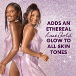 Two women posing back-to-back in shimmering satin dresses against a glittery lavender background, with promotional text on the right reading 'ADDS AN ETHEREAL Rose Gold GLOW TO ALL SKIN TONES'.