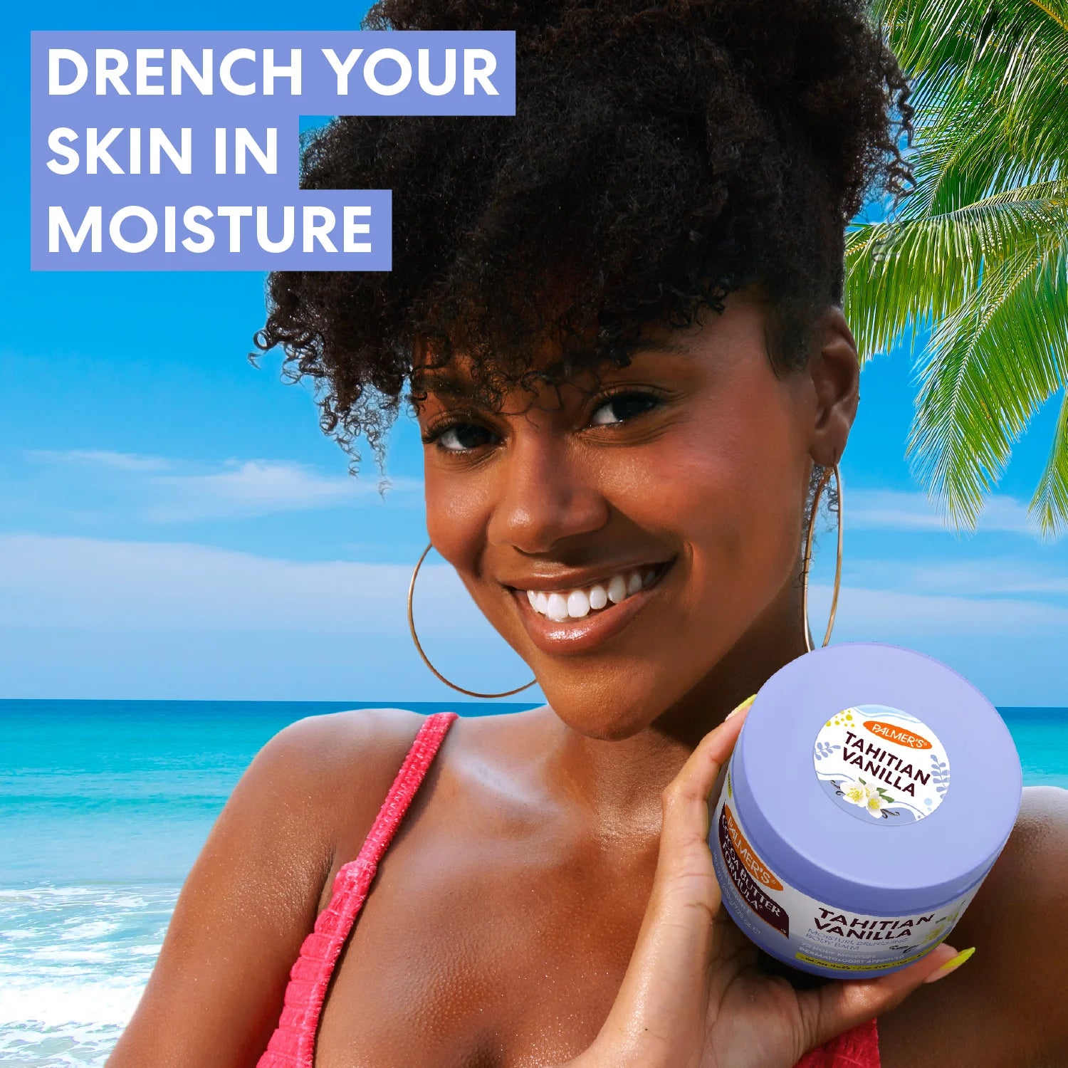 Woman holding a container of Palmer's Tahitian Vanilla Body Balm with a beach background and text 'Drench Your Skin in Moisture'.