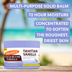 Palmer's Tahitian Vanilla Body Balm on wooden table with beach background with product benefit copy