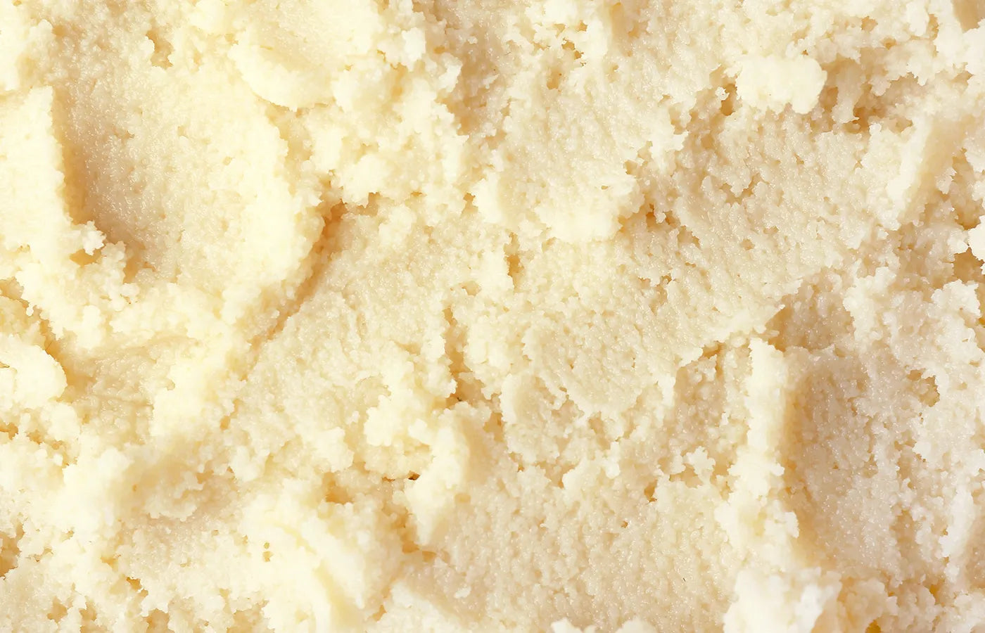 Close-up of smooth, light-colored shea butter