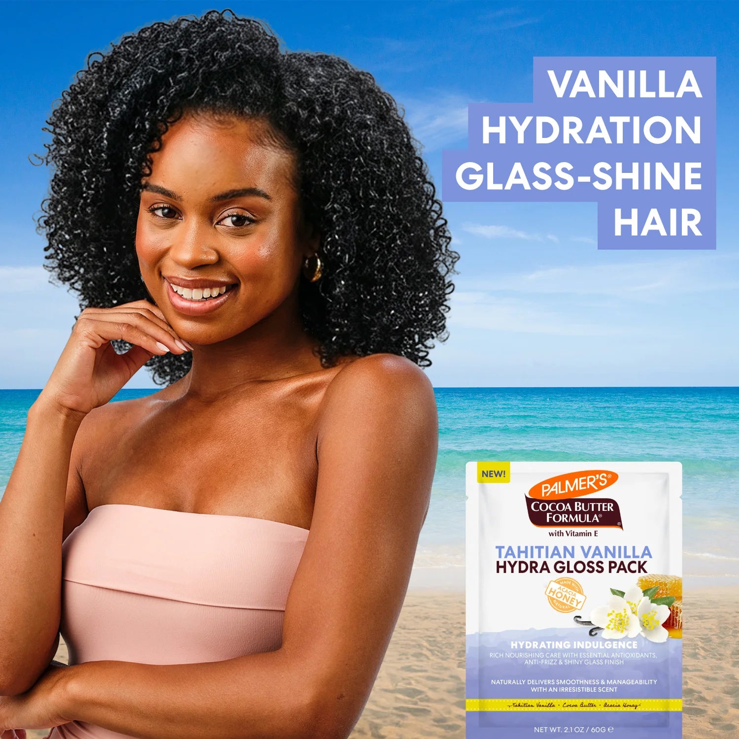 Woman with styled hair on a beach, with Palmer's Cocoa Butter Formula Tahitian Vanilla Hydra Gloss Pack