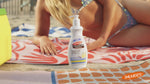 Women on a beach using Palmer's Tahitian Vanilla skin care products