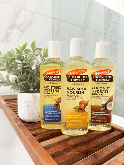 Palmer's Body Oils for glowing skin in wooden tray